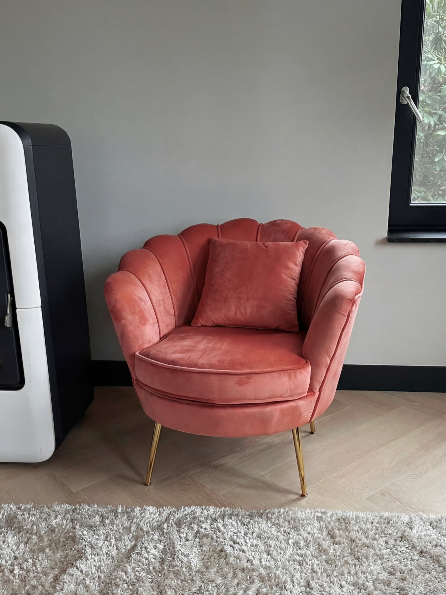 A pink shell chair placed by Zieny AI inside a real customer's living room